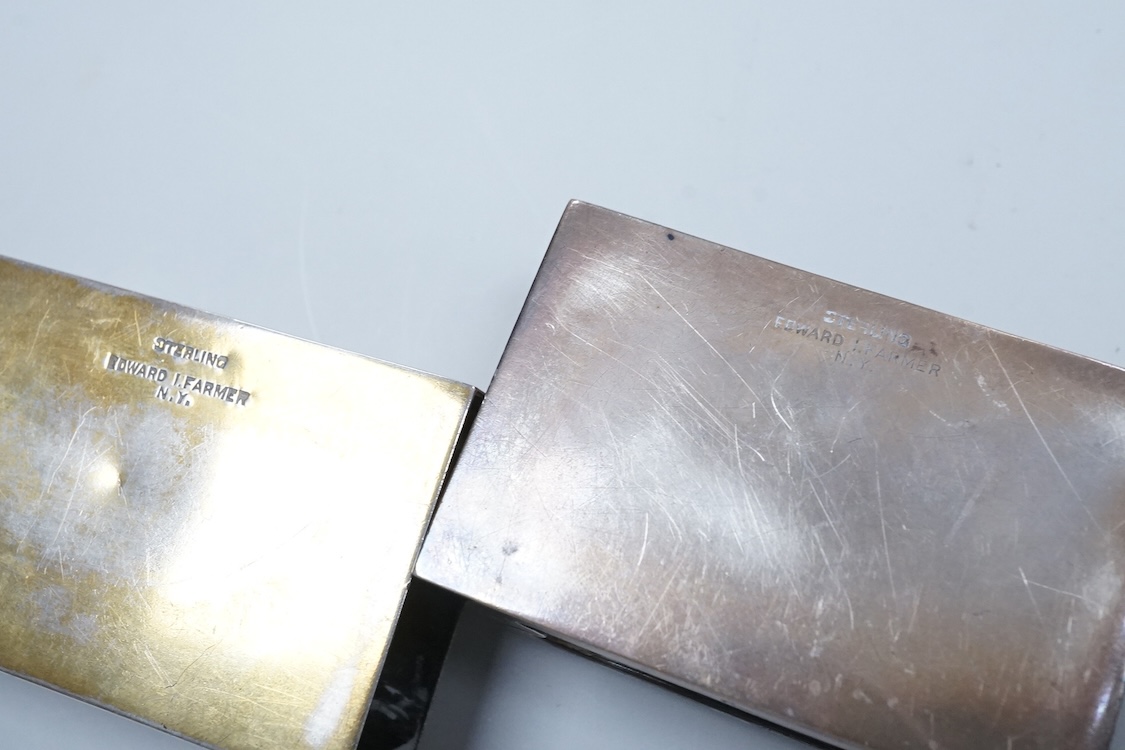 Two North American Edward I. Farmer of New York engraved sterling matchbox slides, one mounted with a jadeite carving, the other with polychrome enamelled surmount, both approximately 60mm.